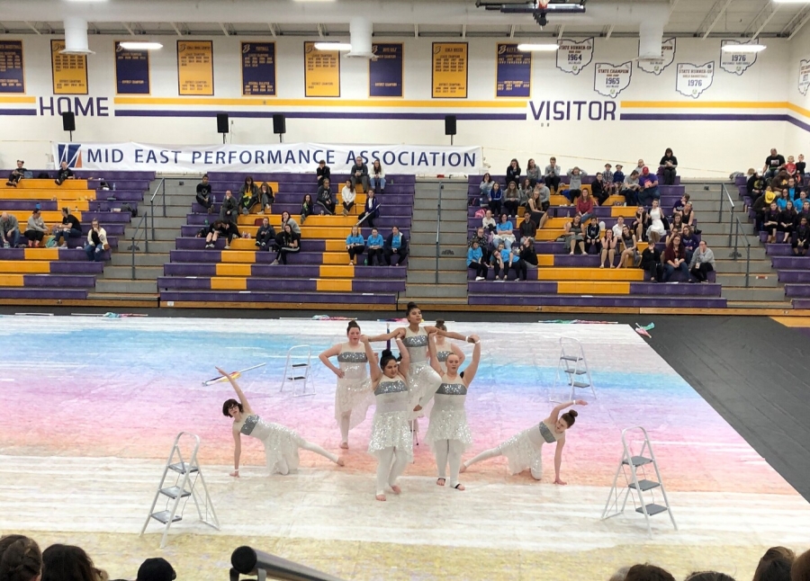 group of performers in white